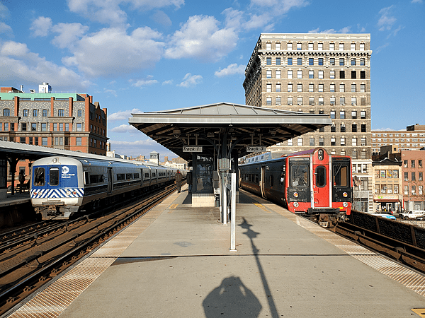 Two trains at Harlem-125th Street station, December 2021