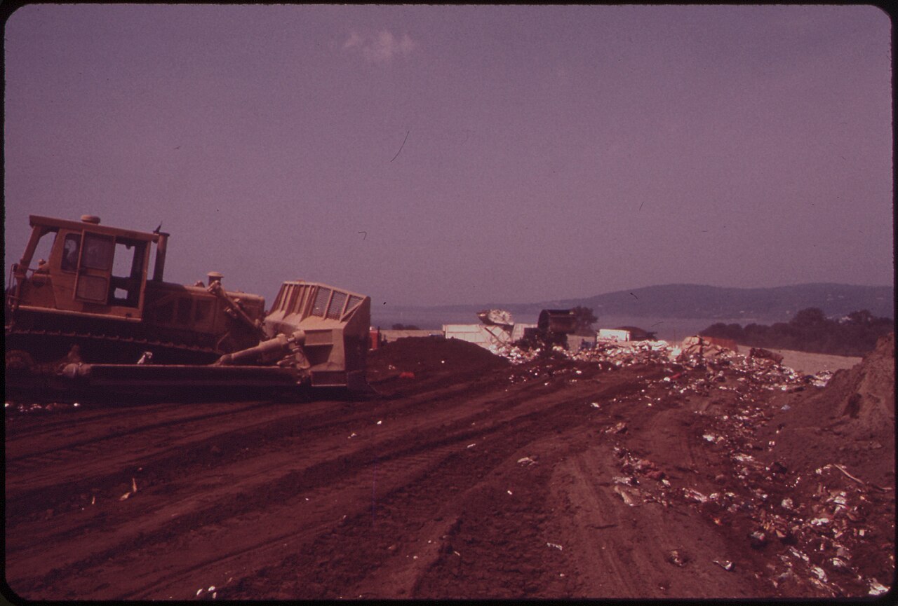 GARBAGE IS COVERED BY ONE FOOT OF EARTH IN CROTON LANDFILL OPERATION ALONG THE HUDSON RIVER - NARA - 549937.jpg